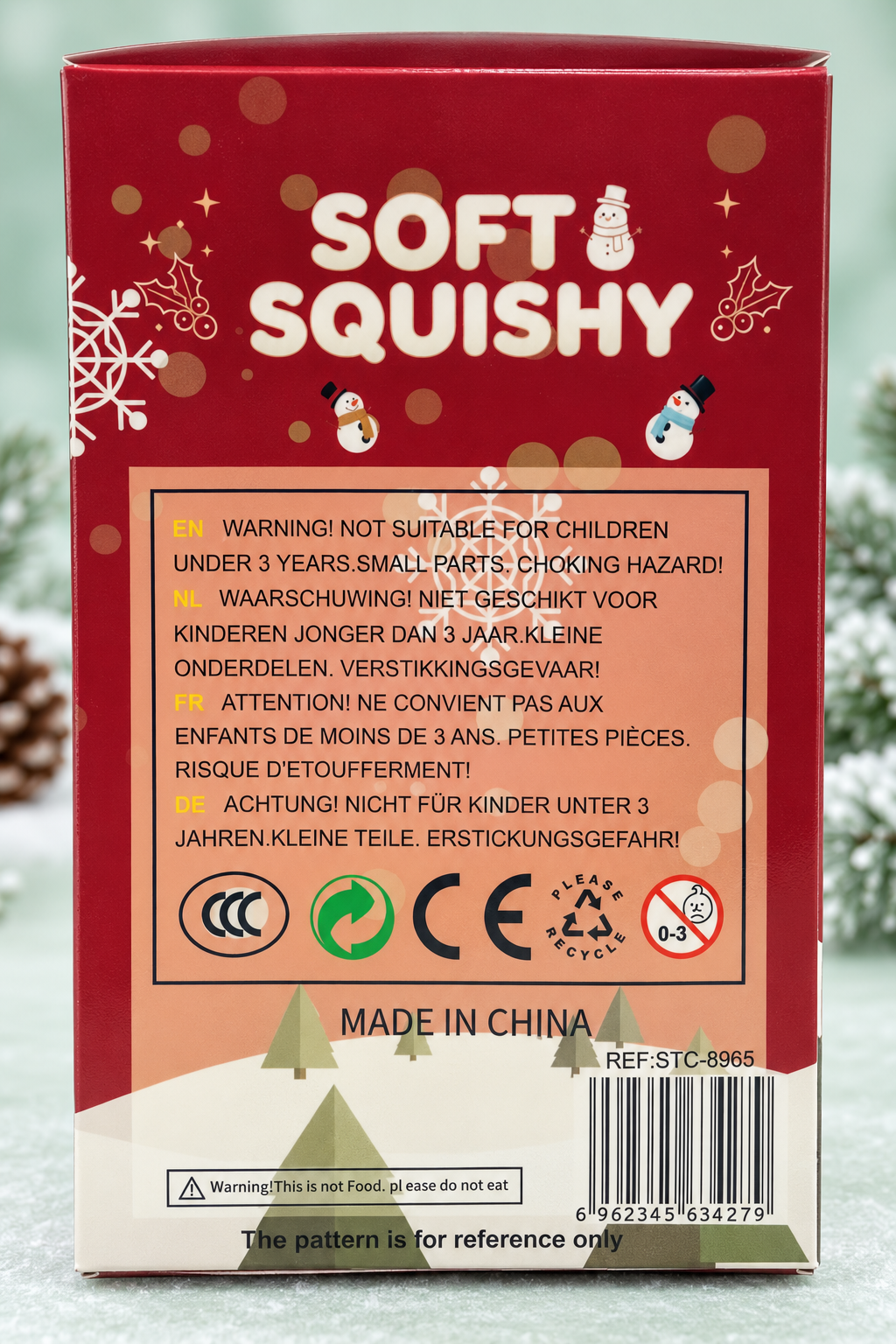 Back of snowman squishy packaging showing warnings and product reference.