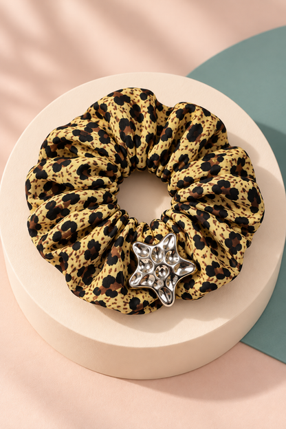 Gold Leopard Melody star-accent scrunchie with neatly arranged gathered fabric