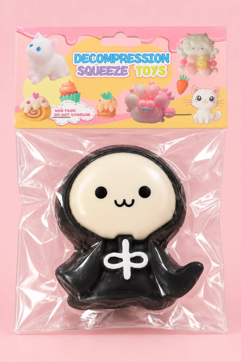 Illustrative front view of black and cream hooded character squishy in pastel package