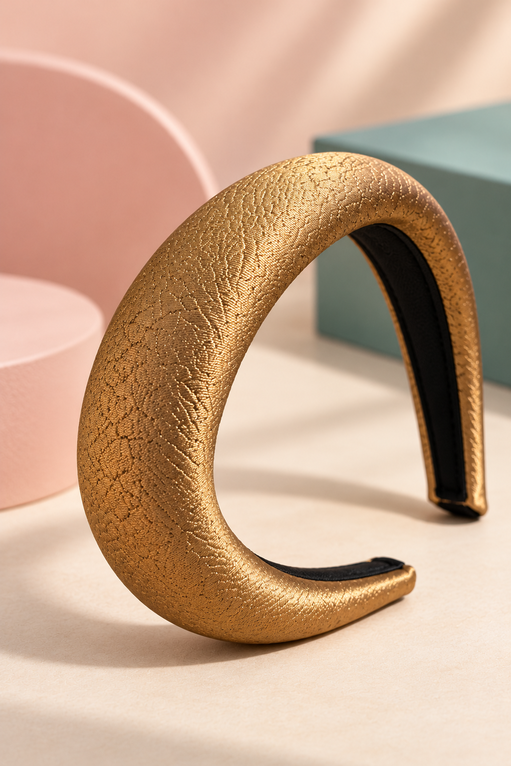Close view of Gold headband textured fabric and black inner lining