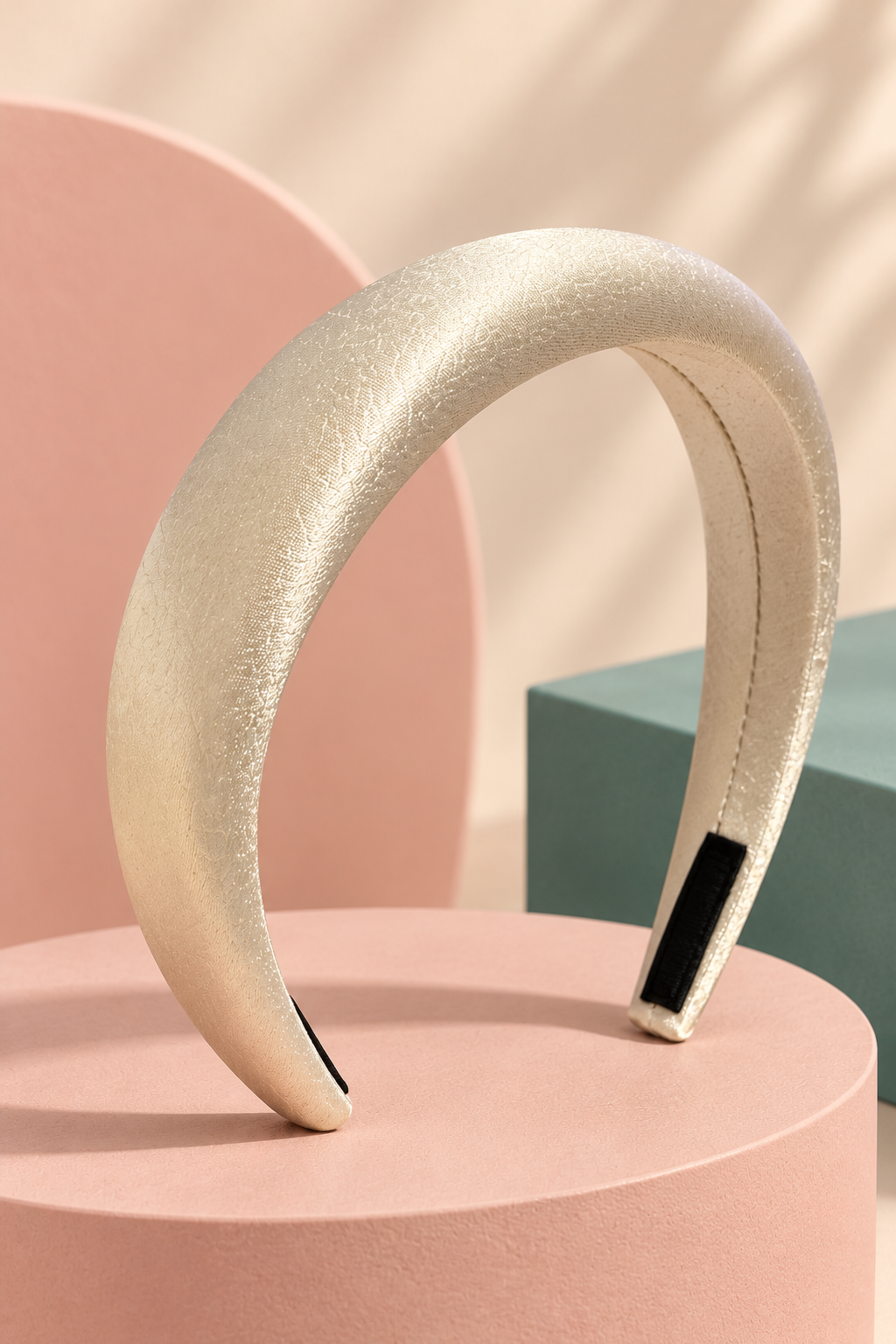 Ivory textured padded headband on a boutique display